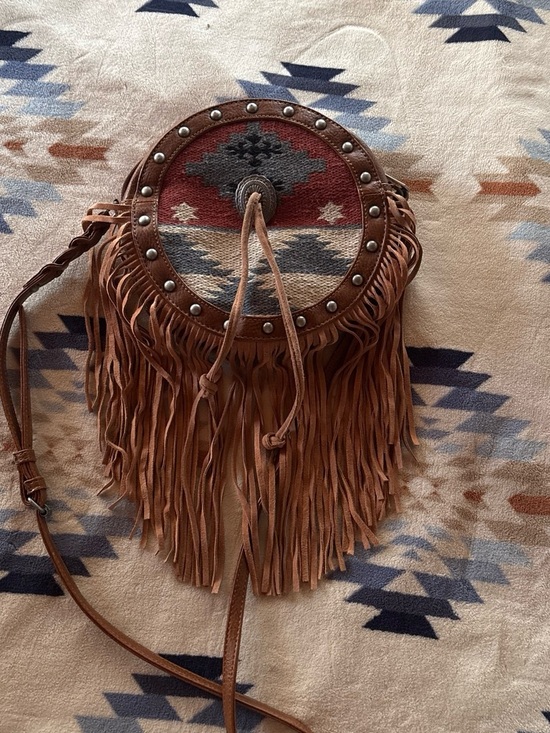 Shyanne Handbags - Shyanne Fringed Round Crossbody Bag with Aztec Textile Panel - Brown
